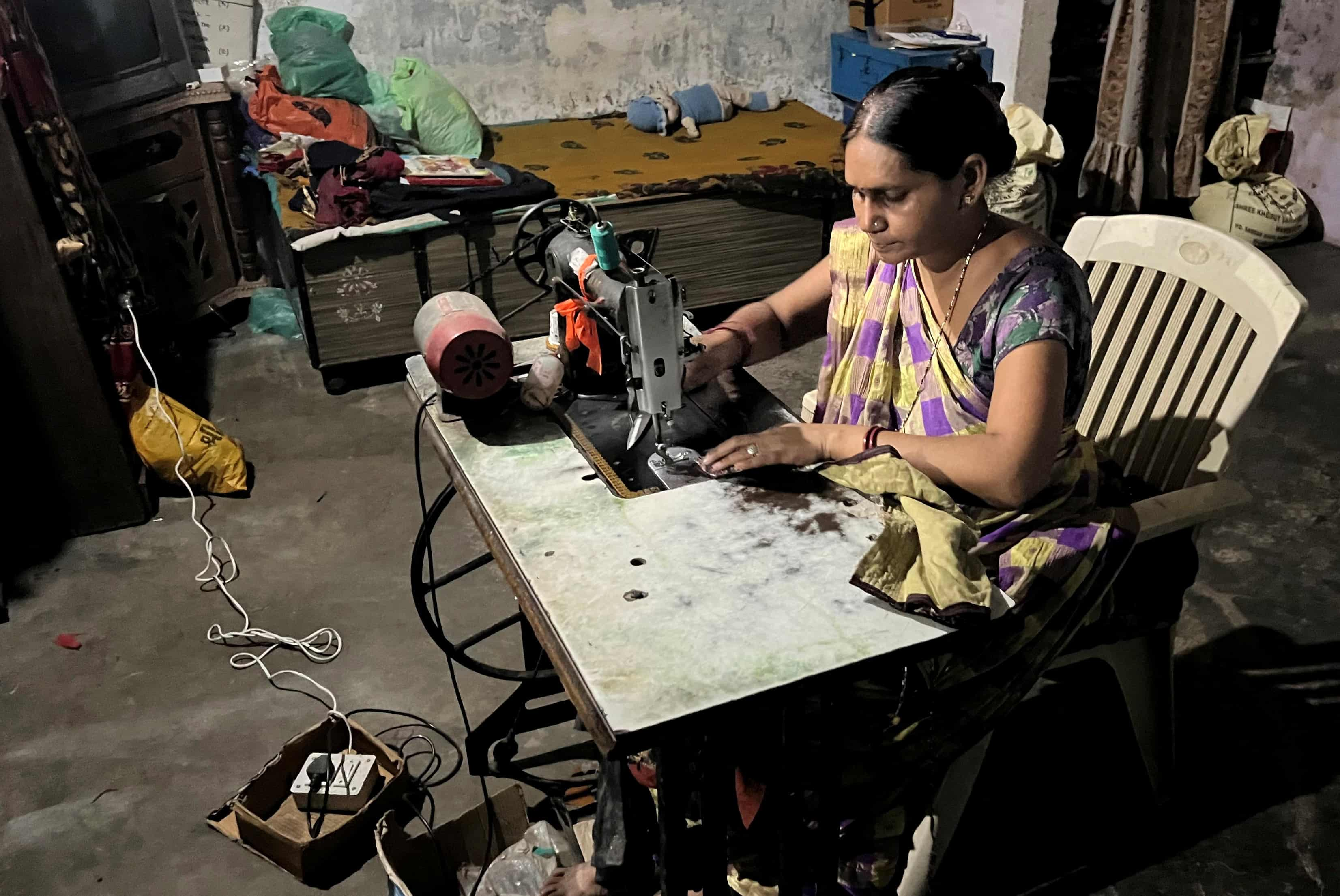 worker-works-on-a-solar-powered-sewing-machine